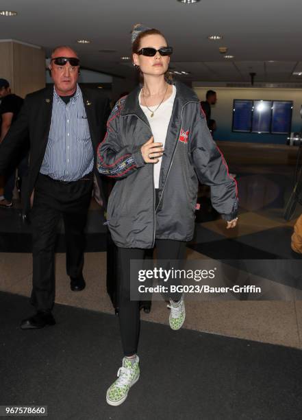 Behati Prinsloo is seen at LAX on June 04, 2018 in Los Angeles, California.