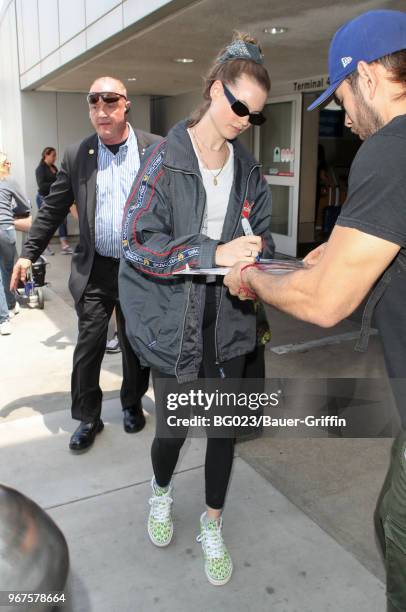 Behati Prinsloo is seen at LAX on June 04, 2018 in Los Angeles, California.
