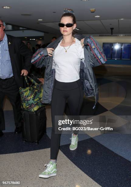 Behati Prinsloo is seen at LAX on June 04, 2018 in Los Angeles, California.