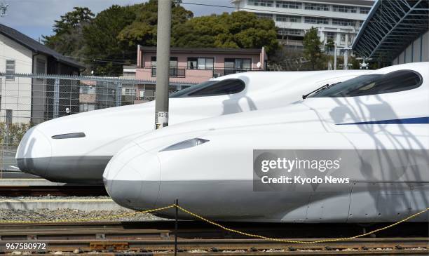 Photo taken on March 10, 2018 in Hamamatsu, central Japan, shows the new N700S series and existing N700 series of Tokaido shinkansen bullet train....