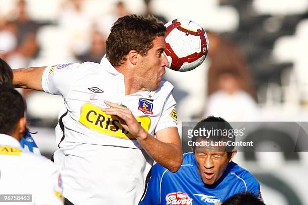 Colo Colo's Andres Scotti batlles for the ball against Evelio Hernandez of Deportivo Italia during their 2010 Libertadores Cup match on February 16,...