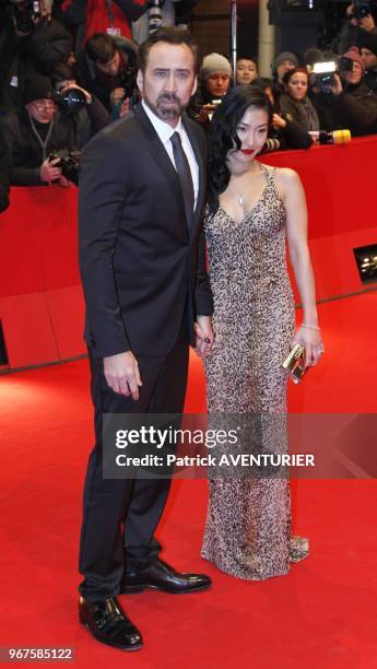 Nicolas Cage and Alice Kim attend the premiere for the movie 'The Croods' during the 63rd Berlinale International Film Festival on February 15, 2013...