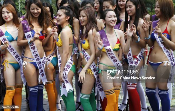 Contestants attend a bikini show with the theme of FIFA World Cup during Miss Tourism Queen International on June 4, 2018 in Jiaxing, China.