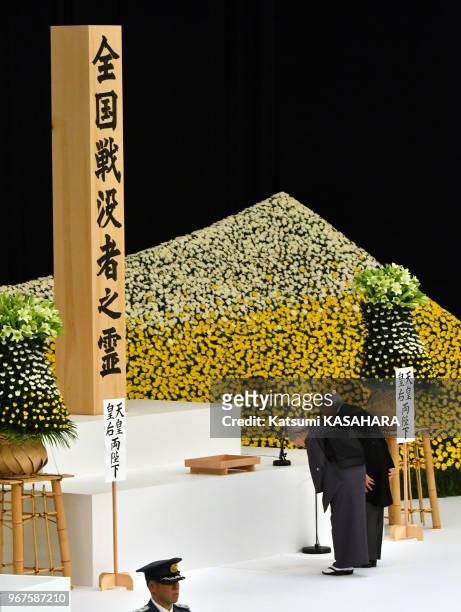 Japan's emperor Akihito and empress Michiko bow their head deeply during the 72th anniversary ceremony of the end of World War II at Tokyo Budokan...