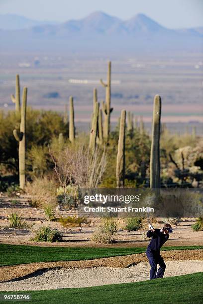 Luke Donald of England hits a shot out of a bunker during the second practice round prior to the start of the Accenture Match Play Championship at...