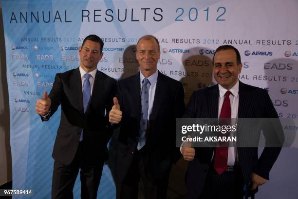 Harald Wilhem, EADS CFO, Tom Enders EADS CEO and Marwan Lahoud, EADS CSMOs attend the annual news conference in Berlin February 27, 2013. The...