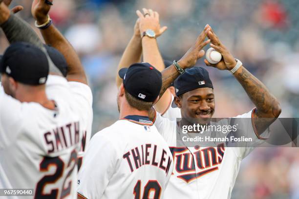 Stefon Diggs of the Minnesota Vikings leads the crowd in a skol chant before the game between the Minnesota Twins and the Cleveland Indians on June...