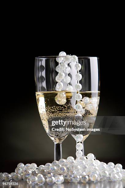 new years eve glamour toast - pearl necklace stock pictures, royalty-free photos & images