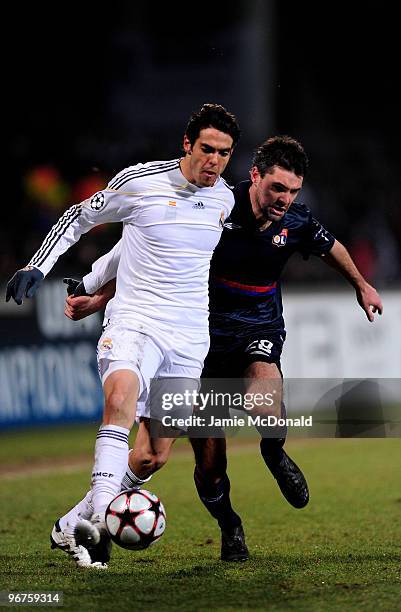 Kaka of Real Madrid is tackled by Jeremy Toulalan of Lyon during the UEFA Champions League round of 16 first leg match between Lyon and Real Madrid,...