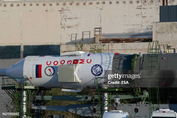 In this handout image provided by ESA, A Soyuz-FG rocket booster carrying the Soyuz MS-09 spacecraft being transported from an assembling facility to...