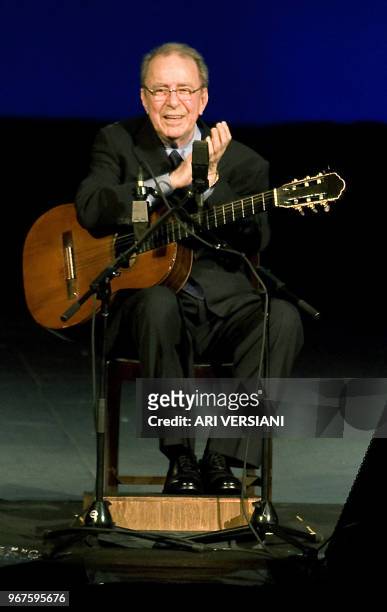 Brazilian musician Joao Gilberto acknowledges the audience during his presentation late at night on August 24, 2008 at the Teatro Municipal in Rio de...