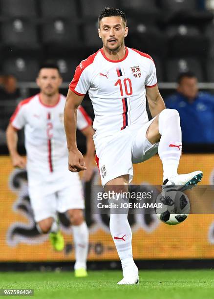 Serbia's Dusan Tadic controls the ball during the international friendly football match Serbia v Chile at the Merkur Arena in Graz, Austria on June...