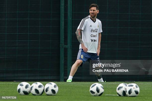 Argentina's forward Lionel Messi takes part in a training session at the FC Barcelona 'Joan Gamper' sports centre in Sant Joan Despi near Barcelona...