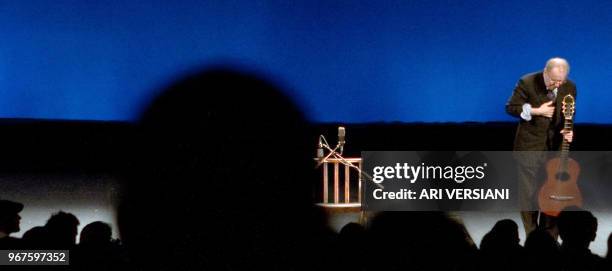 Brazilian musician Joao Gilberto acknowledges the audience during his presentation late at night on August 24, 2008 at the Teatro Municipal in Rio de...