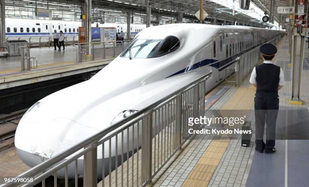 Photo taken on June 5 shows a new N700S Tokaido shinkansen bullet train arriving at Shin-Osaka station in Osaka, western Japan, during a test run....