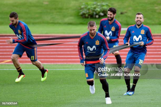 Spain's midfielder Koke, Spain's defender Sergio Ramos, Spain's midfielder Isco and Spain's defender Jordi Alba attend a training session at Las...