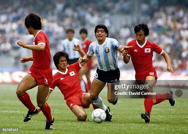 Diego Maradona of Argentina is fouled by players from the Republic of Korea during the Group A match at the 1986 FIFA World Cup on 2 June 1986 at the...