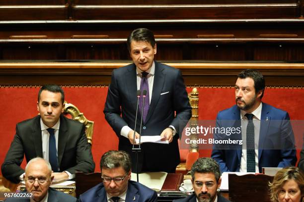 Giuseppe Conte, Italy's prime minister, center, delivers his maiden speech to the Senate, as Luigi Di Maio, Italy's deputy prime minister, left, and...