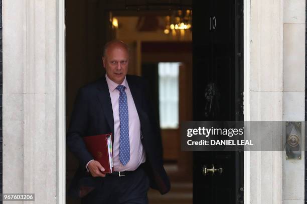 Britain's Transport Secretary Chris Grayling leaves from 10 Downing Street in central London after attending the weekly cabinet meeting on June 5,...
