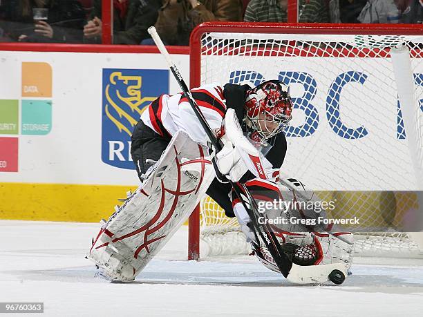 Justin Peters of the Carolina Hurricanes goes down in the crease to make a save during a NHL game against the New Jersey Devils on February 13, 2010...