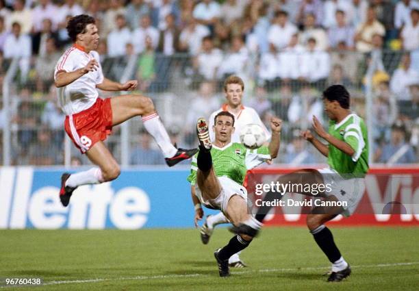 Marco Van Basten of the Netherlands challenges Hossam Hassan of Egypt during their Group F match of the 1990 FIFA World Cup on 12 June 1990 at the...