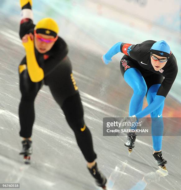 Heather Richardson competes with China's Aihua Xing in her speedskating Ladies 500m race at the Richmond Olympic oval in Richmond outside Vancouver...