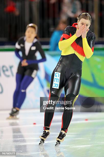 Jenny Wolf of Germany reacts after finishing second to Lee Sang-Hwa of South Korea during the women's speed skating 500 m on day five of the...