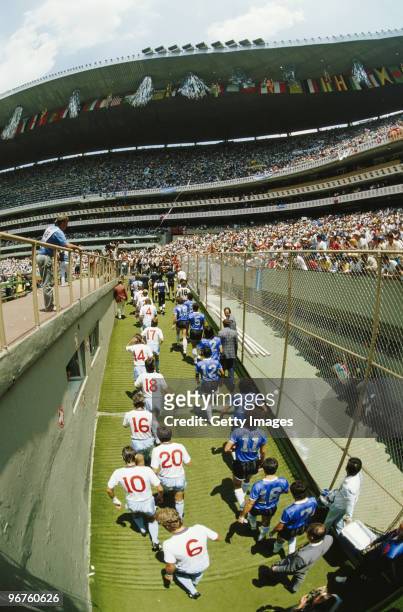 The players from Argentina and England walk onto the pitch during the 1986 FIFA World Cup Quarter Final on 22 June 1986 at the Azteca Stadium in...
