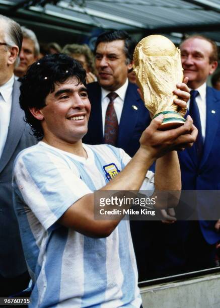 Diego Maradona of Argentina lifts the trophy and celebrates winning the FIFA World Cup final on 29 June 1986 against West Germany at the Azteca...