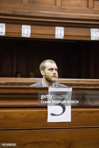 Henri Van Breda sits in the dock at the Western Cape High Court, in Cape Town on June 5 to hear the sentence in his trial for the alleged killing of...