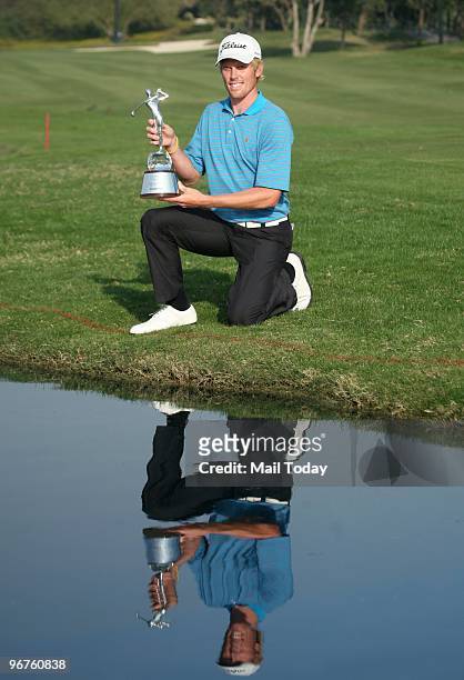 Australian Golfer Andrew Dodt with the Avantha Masters trophy at the DLF Golf and Country Club on Sunday, February 14, 2010.