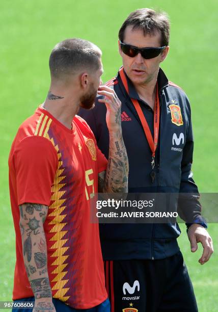 Spain's coach Julen Lopetegui talks to Spain's defender Sergio Ramos during a training session at Las Rozas de Madrid sports city on June 5, 2018.