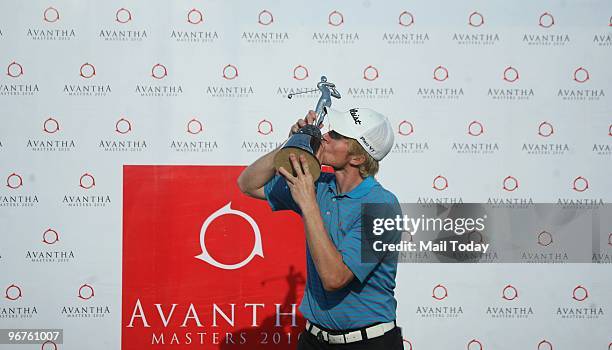 Australian Golfer Andrew Dodt with the Avantha Masters trophy at the DLF Golf and Country Club on Sunday, February 14, 2010.