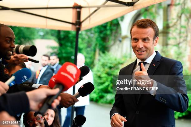 French President Emmanuel Macron speaks to the press during his visit in Clairefontaine-en-Yvelines, to meet France national football team players on...
