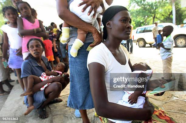 In this handout image provided by the United Nations Stabilization Mission in Haiti , Cuban doctors administer vaccinations for Tetnus and Dyptheria...