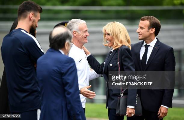 France's head coach Didier Deschamps welcomes French President Emmanuel Macron and his wife Brigitte Macron as they visit France's national football...