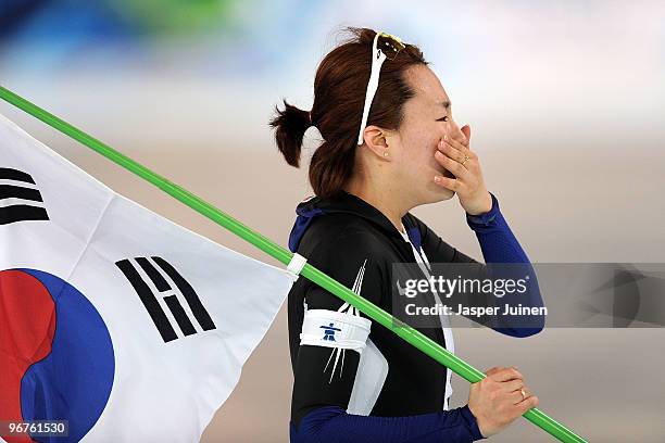 Lee Sang-Hwa of South Korea reacts after winning the gold during the women's speed skating 500 m on day five of the Vancouver 2010 Winter Olympics at...