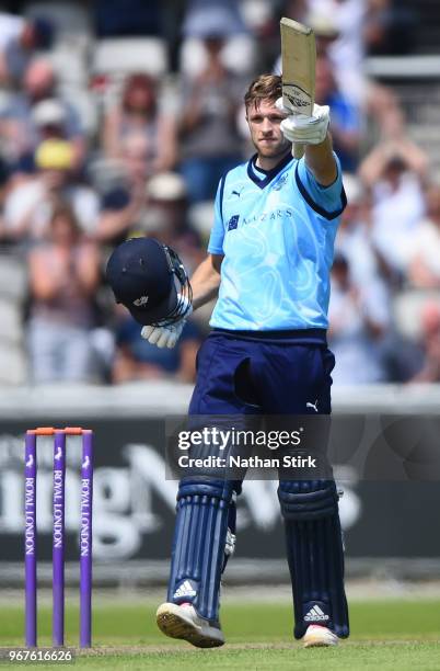 David Willey of Yorkshire raises his bat after scoring 100 runs during the Royal London One Day Cup match between Lancashire and Yorkshire Vikings at...