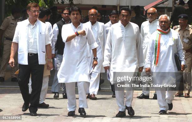 Congress Madhya Pradesh President Kamal Nath with senior Congress leaders Jyotiraditya Madhavrao Scindia and Digvijaya Singh after a meeting with the...