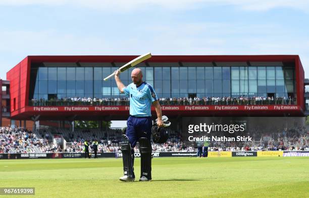 Adam Lyth of Yorkshire raises his bat after scoring 144 runs during the Royal London One Day Cup match between Lancashire and Yorkshire Vikings at...