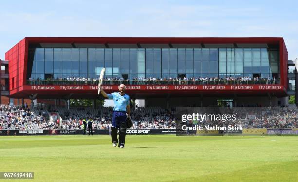 Adam Lyth of Yorkshire raises his bat after scoring 144 runs during the Royal London One Day Cup match between Lancashire and Yorkshire Vikings at...