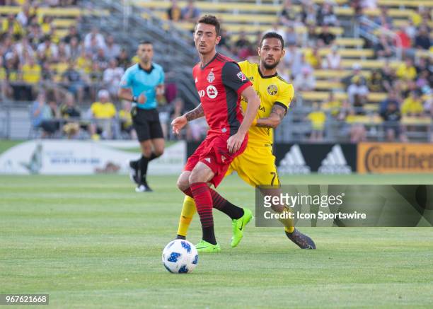 Jay Chapman of Toronto FC and Artur of Columbus Crew SC looks on during the game between the Columbus Crew SC and the Toronto FC at MAPFRE Stadium in...
