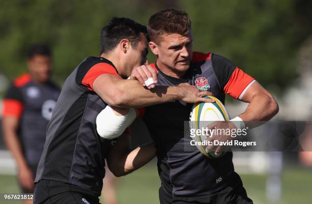 Henry Slade is tackled by Alex Lozowski during the England training session held at Kings Park Stadium on June 5, 2018 in Durban, South Africa.