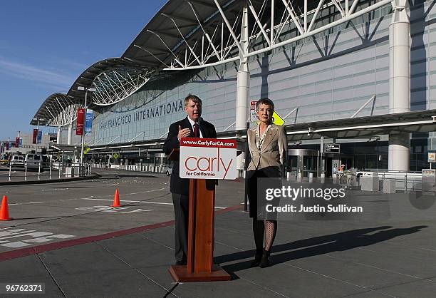 Republican candidate for U.S. Senate and former HP CEO Carly Fiorina looks on as U.S. Sen. Lindsey Graham speaks during a press conference at San...