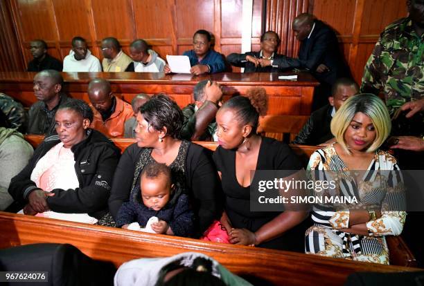 Kenyan Ann Ngirita sits in the dock inside the Mililani Law Courts in Nairobi on June 5, 2018 where she was charged with others among government...