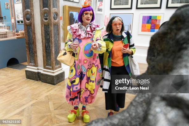 Artist Grayson Perry looks at some of the work on display with his wife Philippa Perry during a press preview of the 250th Summer Exhibition at Royal...