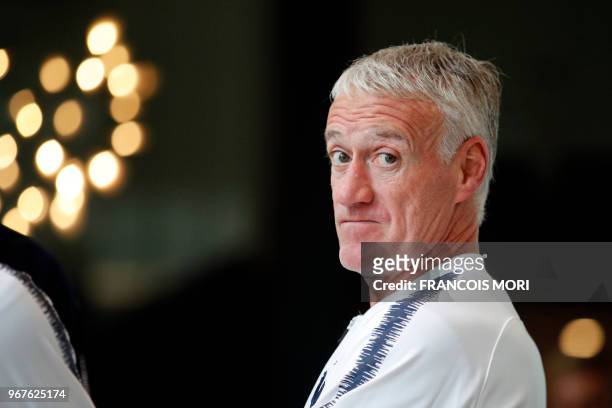 French football national team's head coach Didier Deschamps waits for the arrival of French President before a meeting at France's training camp in...