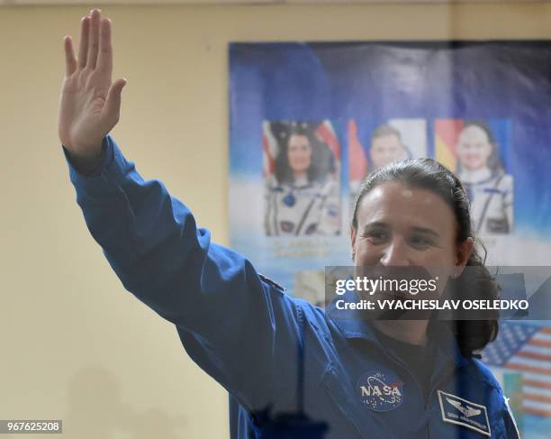 Astronaut Serena Aunon-Chancellor waves during a press conference at the Russian-leased Baikonur cosmodrome in Kazakhstan on June 5, 2018. - The...