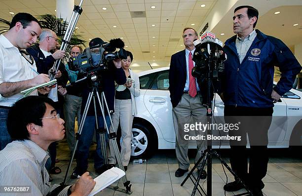 Representative Darrell Issa, right, speaks to member of the media as U.S. Representative Brian Bilbray, second from right, listens during a news...