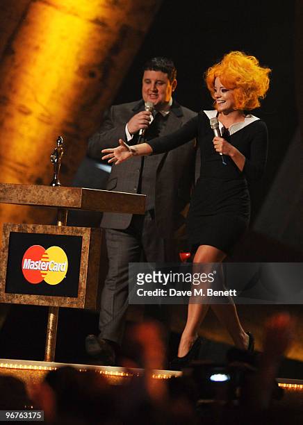 Peter Kay and Lily Allen with her British Female Solo Artist Award on stage during The Brit Awards 2010, at Earls Court One on February 16, 2010 in...